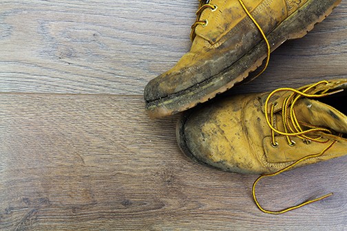Muddy boots on hardwood floors